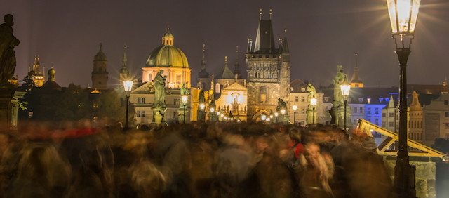 Blurred motion of crowd of people on Charles Bridge in Prague in Night shot of blurred motion of crowd of people on Charles Bridge in Prague