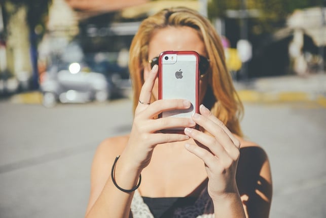 If you keep your cell phone closer to your face, you don't have to tilt your head down.