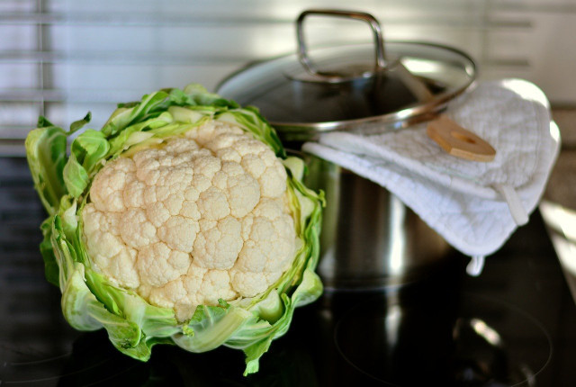 To prepare cauliflower soup, roast a portion of cauliflower