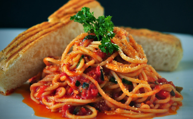 Spaghetti with vegetables and tomato sauce is a quick and popular dish.