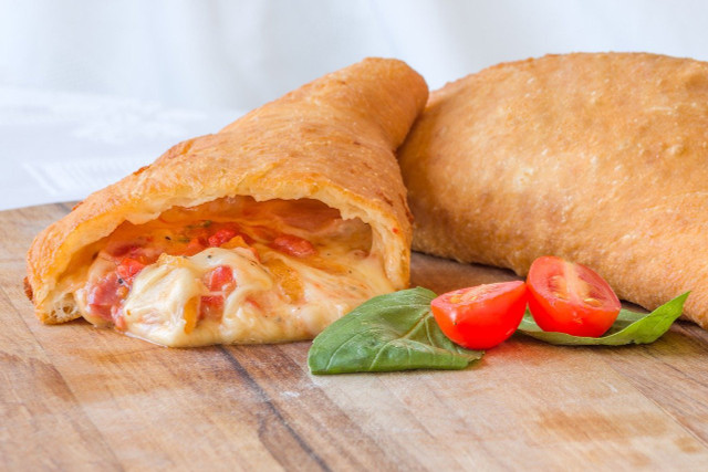 Panzerotti with tomatoes and mozzarella is an Italian classic.