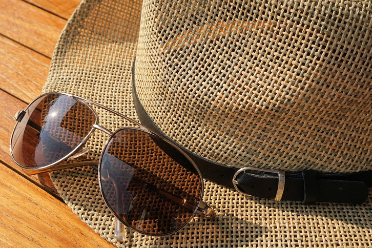 Sunglasses and a hat are a must on warm and sunny days.
