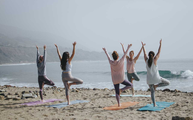 Outdoor sports - yoga on the beach TK outdoor sports