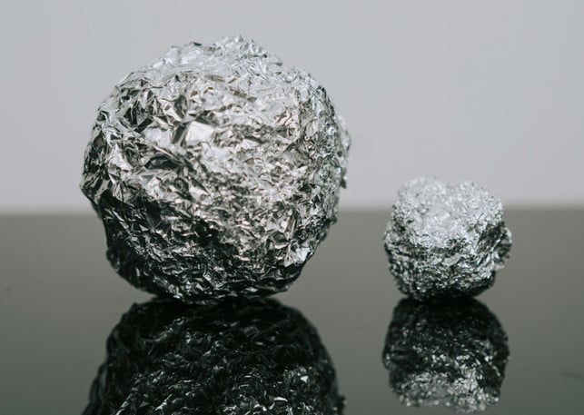 We absorb aluminum in various ways, but licking yoghurt cups is very slightly part of it.