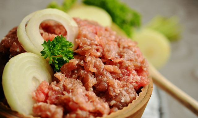 Risk groups should not eat raw meat to protect themselves from listeria.