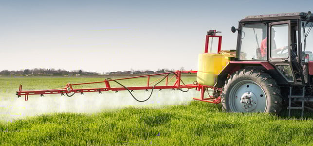 Tractor spraying wheat field Glyphosat Appell