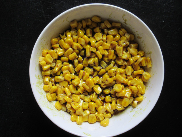 The corn kernels add a crunchy freshness to the tofu salad. 