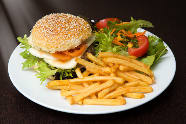 You should avoid burgers and other fast food at dinner.