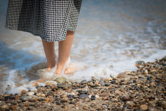 To avoid being bitten by a weever, you should not go into the water barefoot.