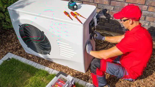 Technician Repairing Heat Pump Unit Wärmepumpe